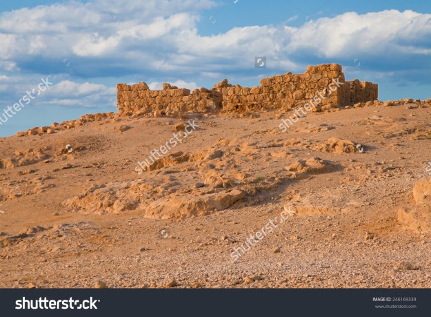 stock-photo-ruined-fort-wall-at-massada-fortress-in-negev-desert-israel-246169339